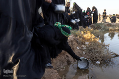 مراسم نمادین خاکسپاری شهدای کربلا در حمیدیه